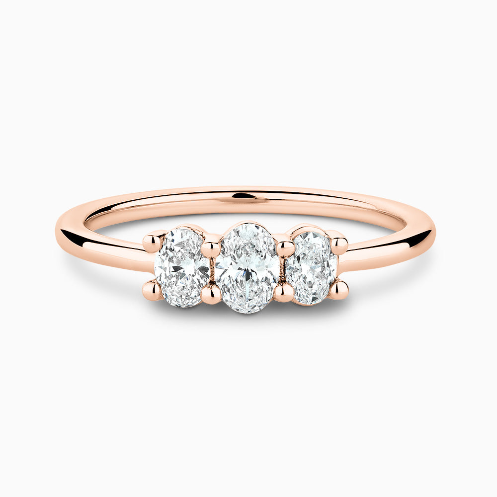 The Ecksand Three-Stone Oval-Cut Diamond Ring shown with Lab-grown 0.25 ctw, VS2+/ F+ in 18k Rose Gold