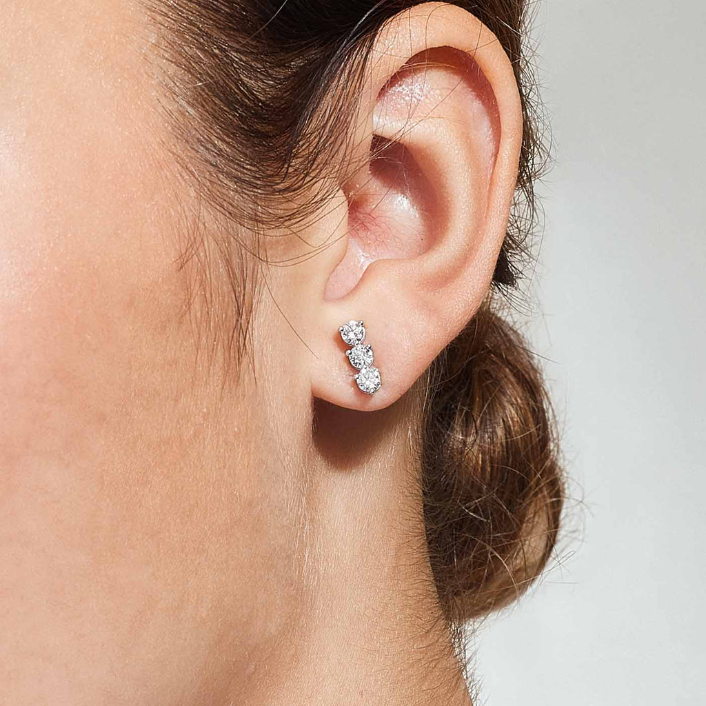 The Ecksand Three-Diamond Bar Earrings shown with  in 