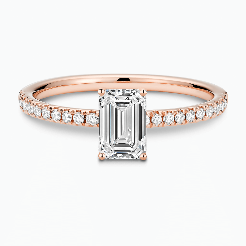 The Ecksand Basket-Setting Diamond Engagement Ring with Diamond Bridge shown with Emerald in 14k Rose Gold