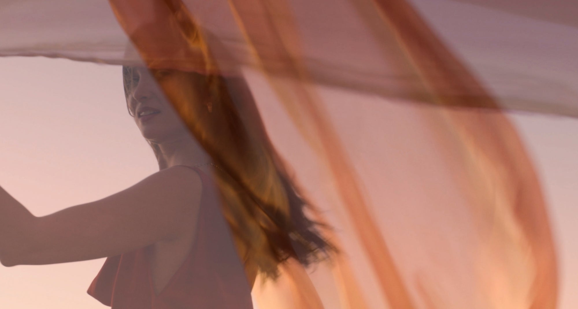 Full-screen cinematic video with a moody, atmospheric tone teasing Ecksand’s Aura collection. Soft lighting highlights glimmers of gold and diamond jewelry as the camera moves through shadows and reflections, evoking mystery, elegance, and transformation.