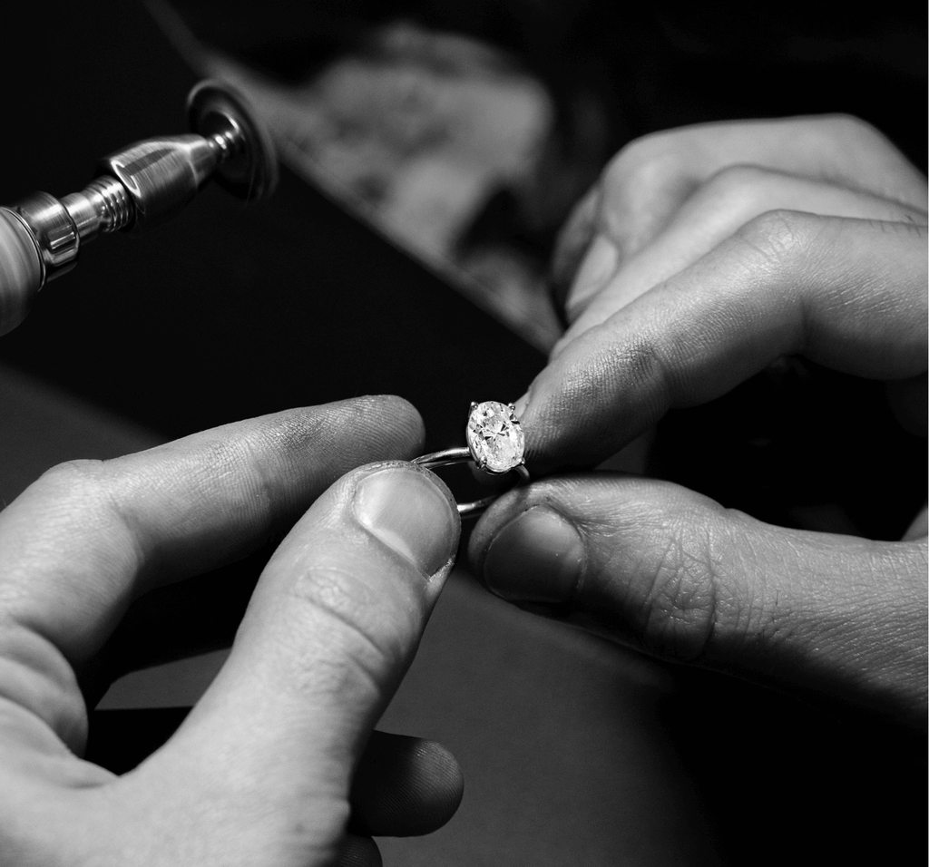 ecksand solitaire oval cut diamond engagement ring being made the by jeweller in workshop
