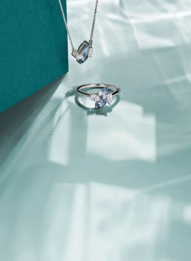 White gold necklace and ring both featuring pear cut aquamarine and marquise cut white diamonds.