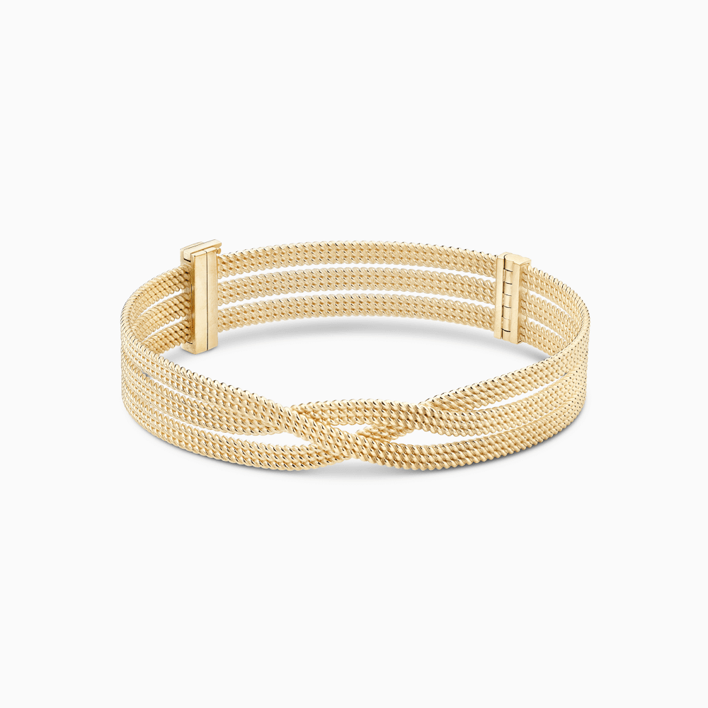 The Ecksand Twisted Gold Bangle shown with  in 14k Yellow Gold