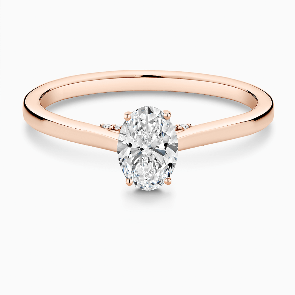 The Ecksand Solitaire Engagement Ring with Diamond Pavé Bridge and Hidden Diamond shown with Oval in 14k Rose Gold