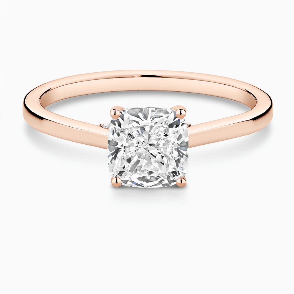 The Ecksand Solitaire Engagement Ring with Diamond Pavé Bridge and Hidden Diamond shown with Cushion in 14k Rose Gold