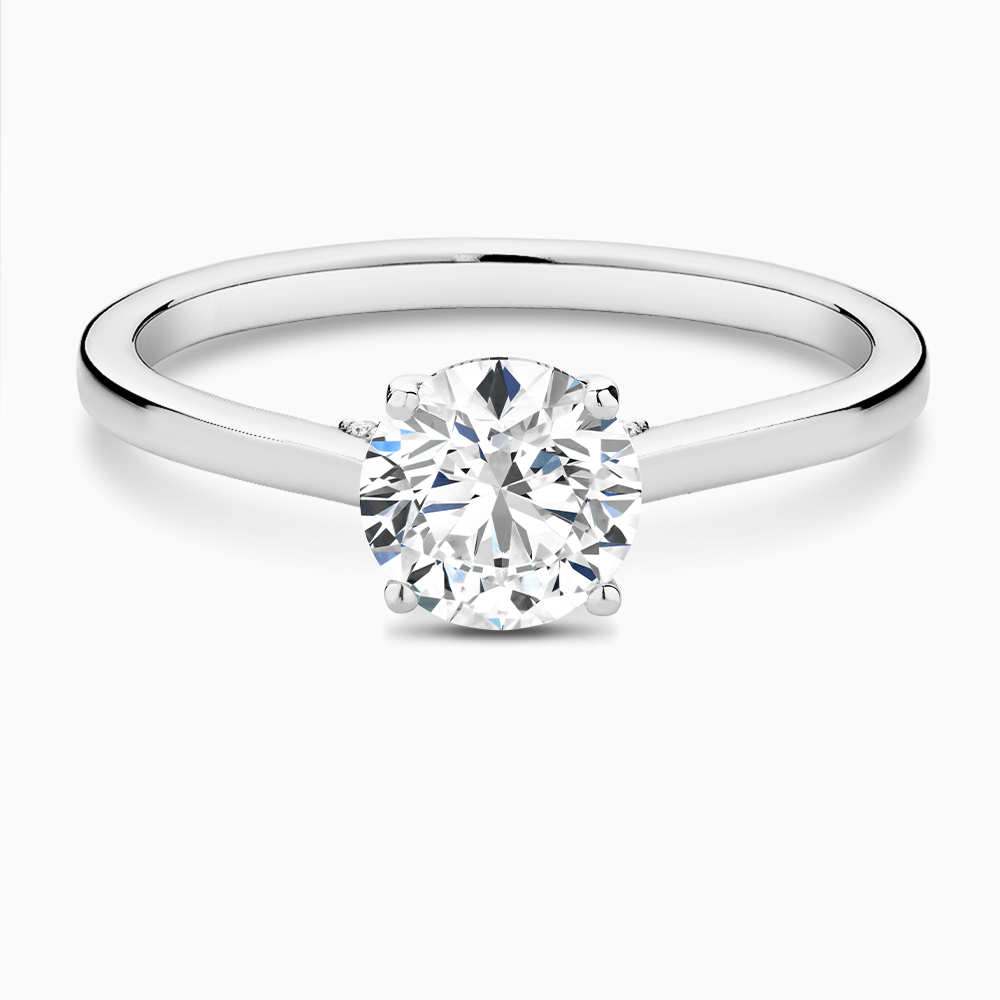 The Ecksand Solitaire Engagement Ring with Diamond Pavé Bridge and Hidden Diamond shown with Round in Platinum