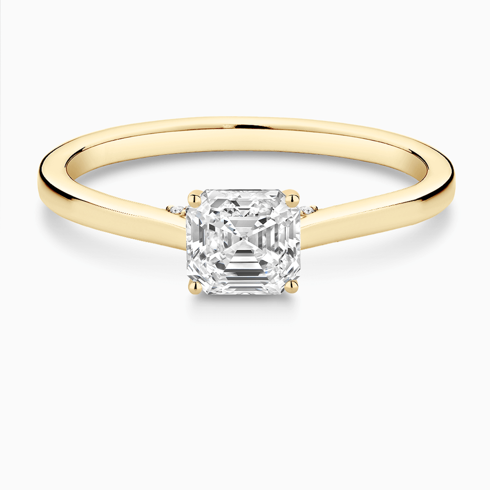 The Ecksand Solitaire Engagement Ring with Diamond Pavé Bridge and Hidden Diamond shown with Asscher in 18k Yellow Gold