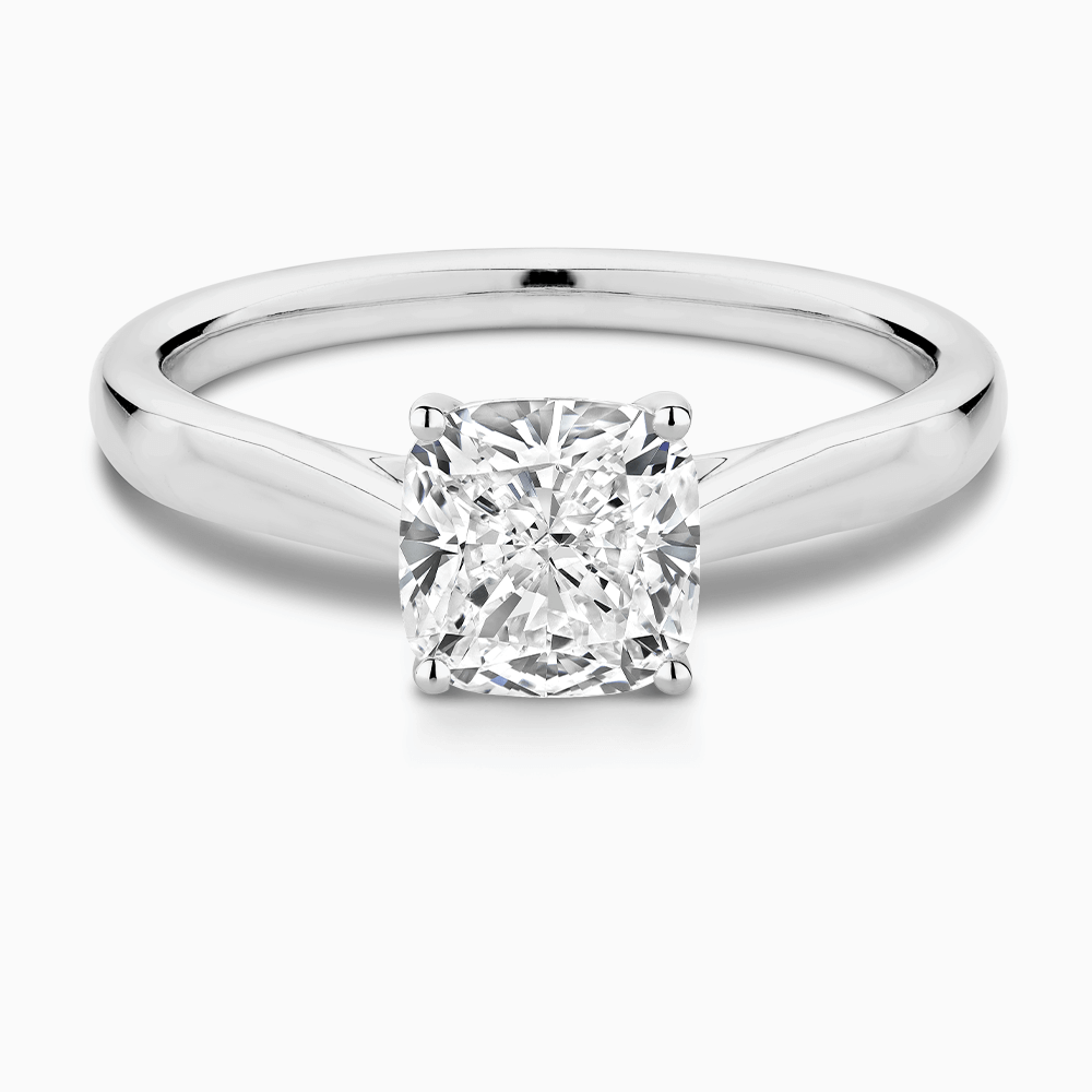 The Ecksand Iconic Tapered Band Solitaire Diamond Engagement Ring with Secret Heart shown with Cushion in 18k White Gold