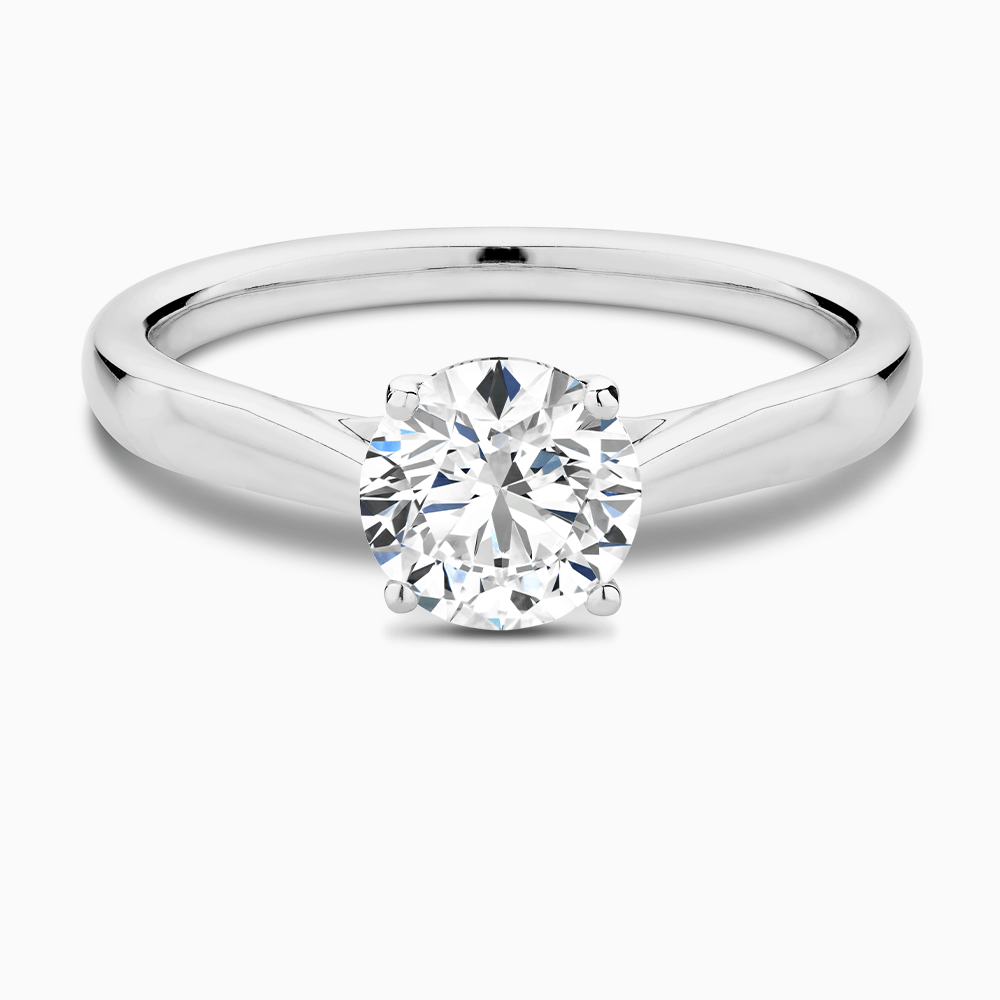 The Ecksand Iconic Tapered Band Solitaire Diamond Engagement Ring with Secret Heart shown with Round in 18k White Gold
