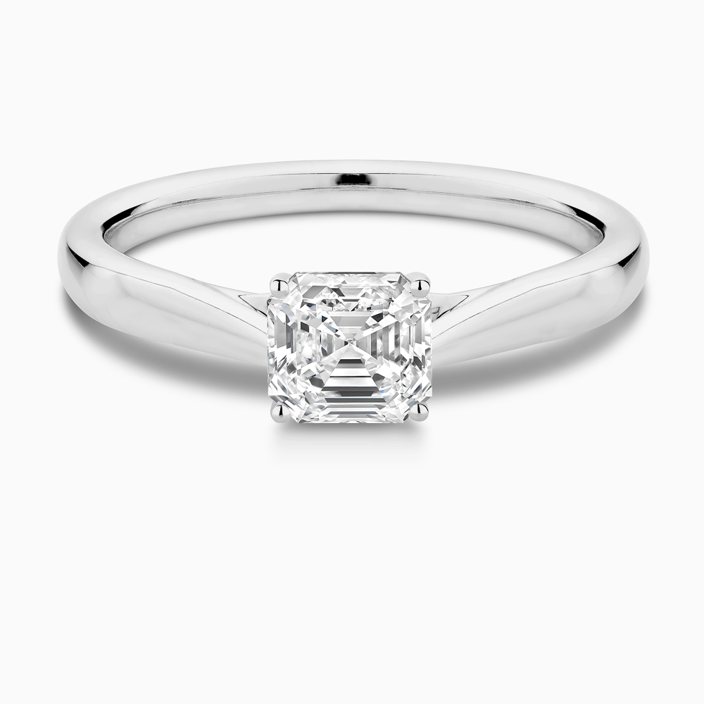 The Ecksand Iconic Tapered Band Solitaire Diamond Engagement Ring with Secret Heart shown with Asscher in 18k White Gold