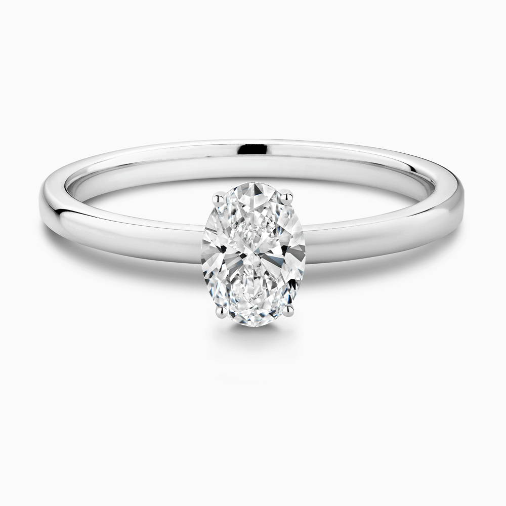 The Ecksand Solitaire Diamond Engagement Ring with Diamond Pavé Basket Setting shown with Oval in 18k White Gold