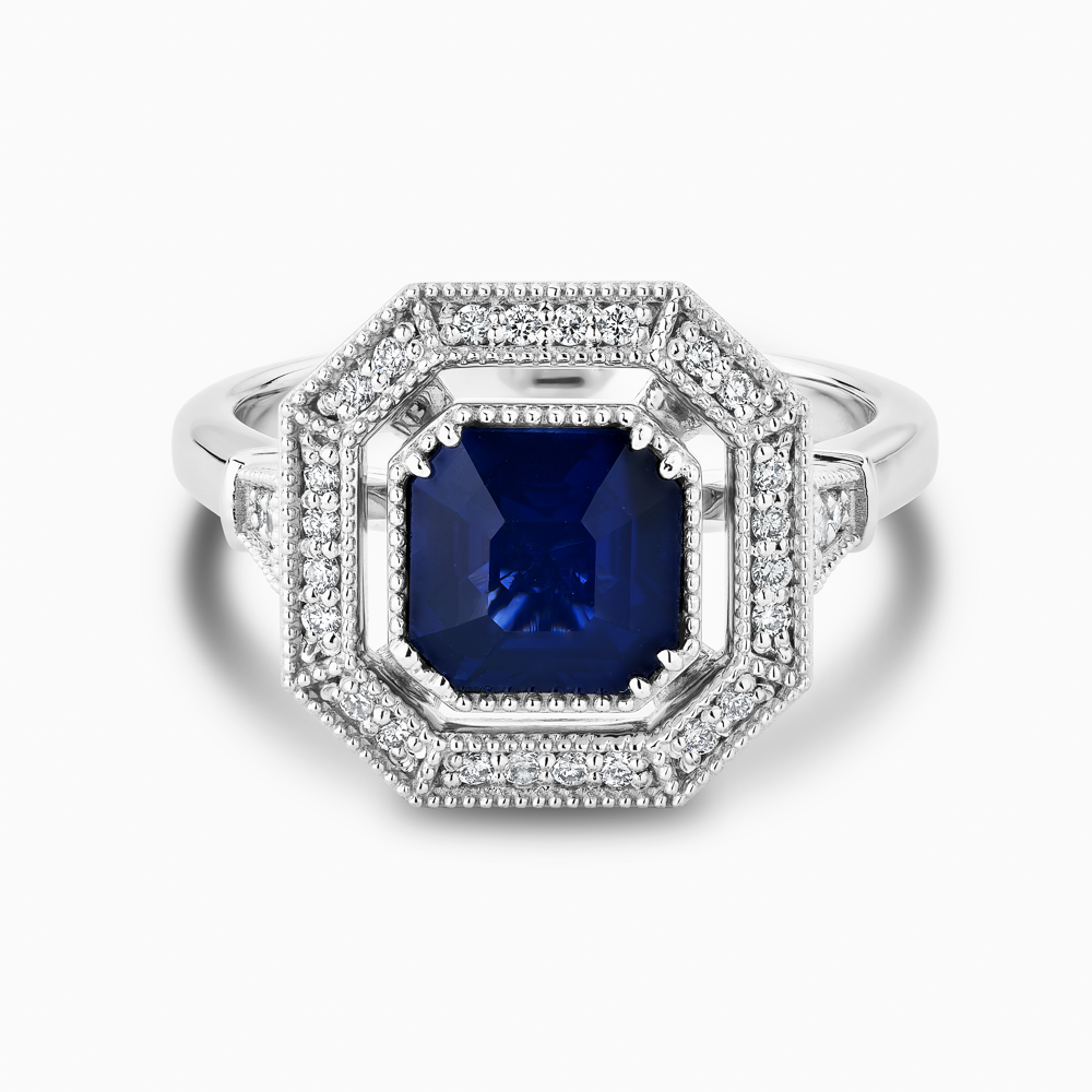 The Ecksand Art-Deco Diamond Halo Engagement Ring with Centre Blue Sapphire shown with  in 18k White Gold