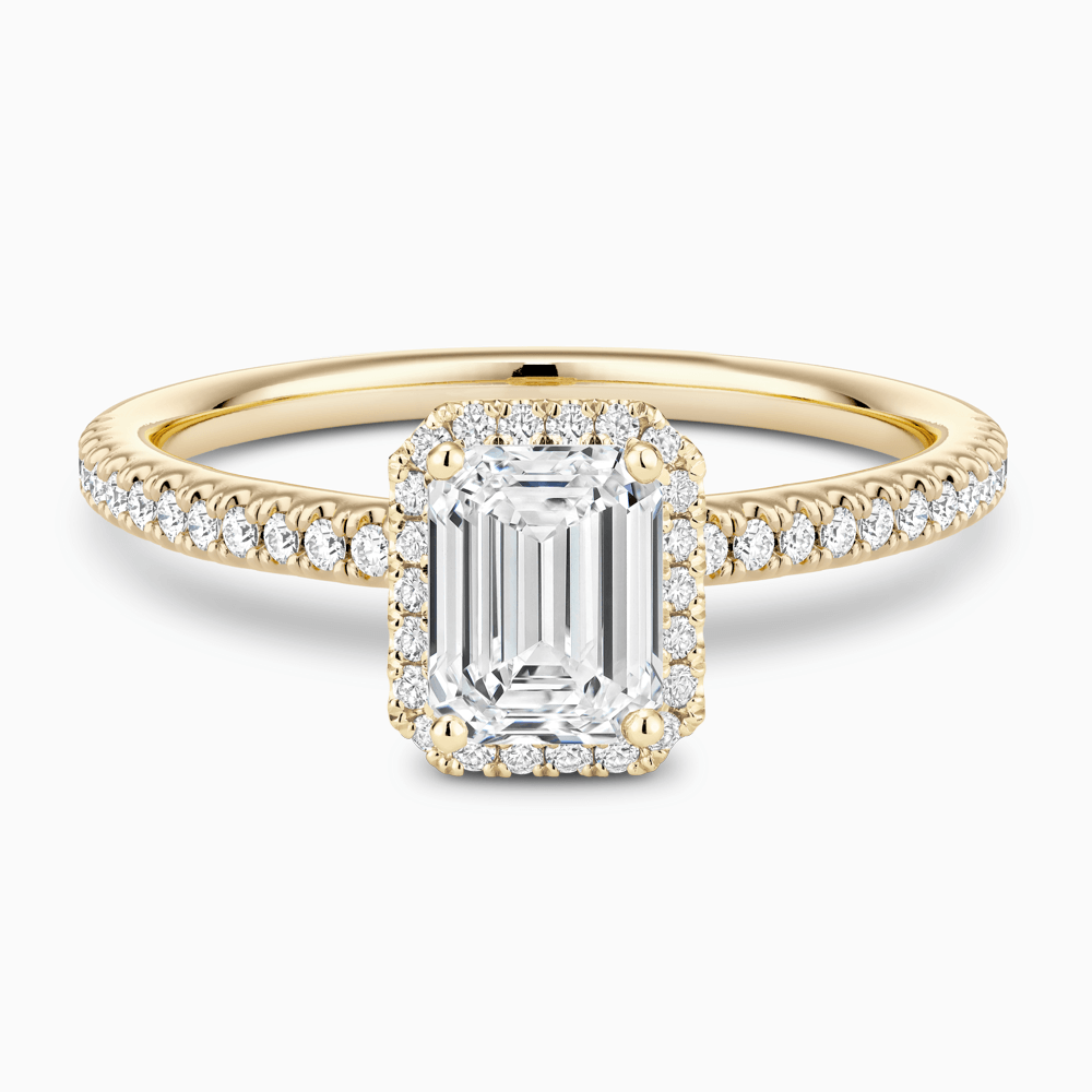 The Ecksand Diamond Halo Engagement Ring with Diamond Band shown with Emerald in 18k Yellow Gold