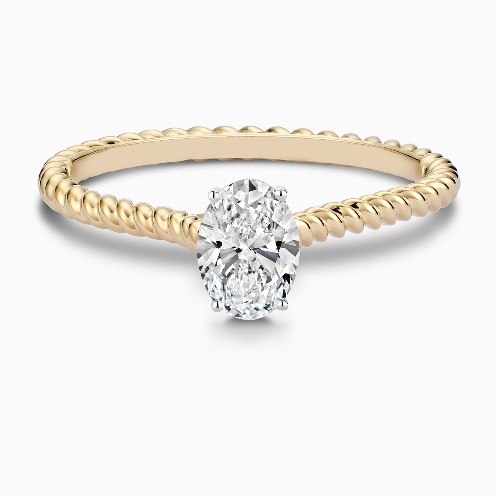 The Ecksand Twisted Diamond Solitaire Engagement Ring shown with Oval in 18k Yellow Gold