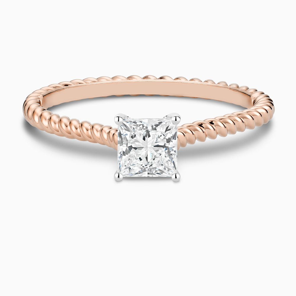 The Ecksand Twisted Diamond Solitaire Engagement Ring shown with Princess in 14k Rose Gold