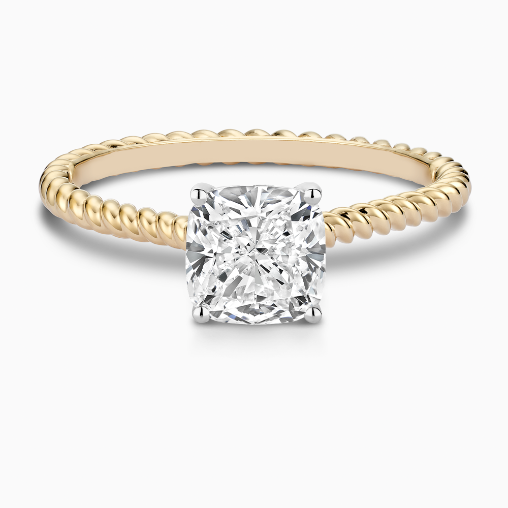 The Ecksand Twisted Diamond Solitaire Engagement Ring shown with Cushion in 18k Yellow Gold