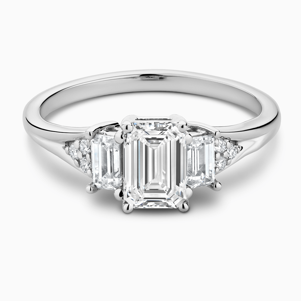 The Ecksand Three-Stone Engagement Ring with Side Diamonds shown with Emerald in 18k White Gold