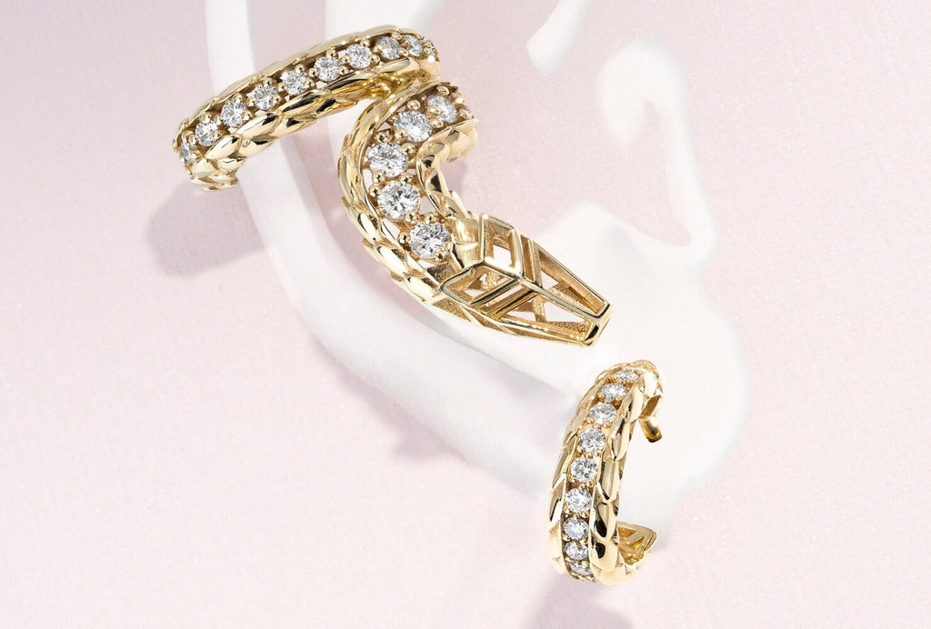 Iconic Dragon Gold Conch Earring with Diamond Pavé Hoop Stud Set in yellow gold on pink background