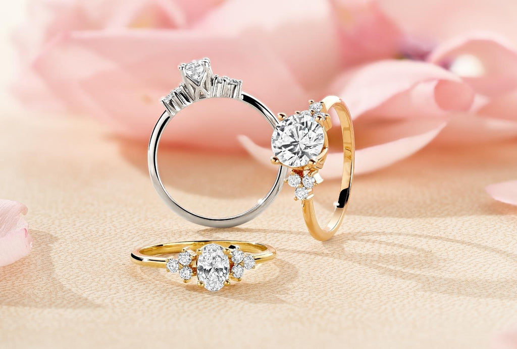 Front-facing photo of three trilogy engagement rings