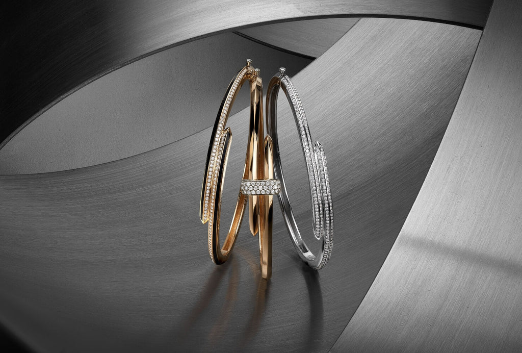 Canadian-made architectural diamond bangles in 18K yellow gold, 18K white gold, and 14K rose gold.