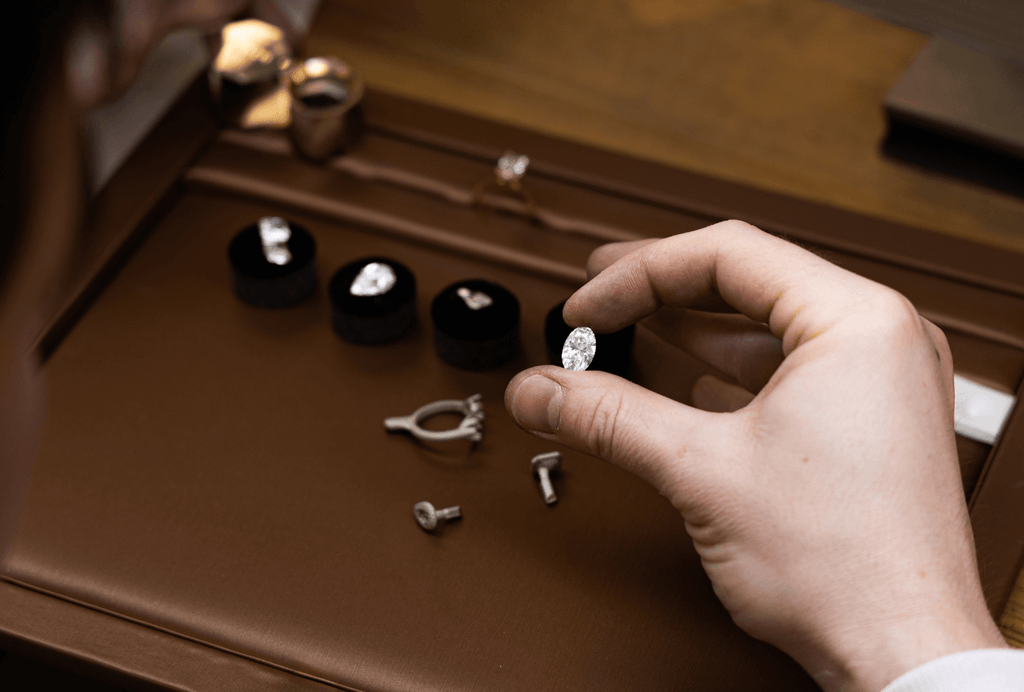 jeweller inspecting a diamond in the ecksand atelier