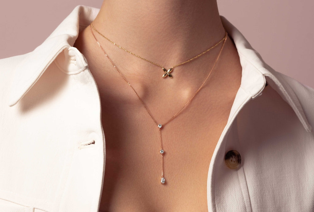 Two photos of Ecksand necklaces. On the left, a model is wearing a selection of Ecksand Gemstone Necklaces and on the right is a close-up photo of two other Gemstone Necklaces.