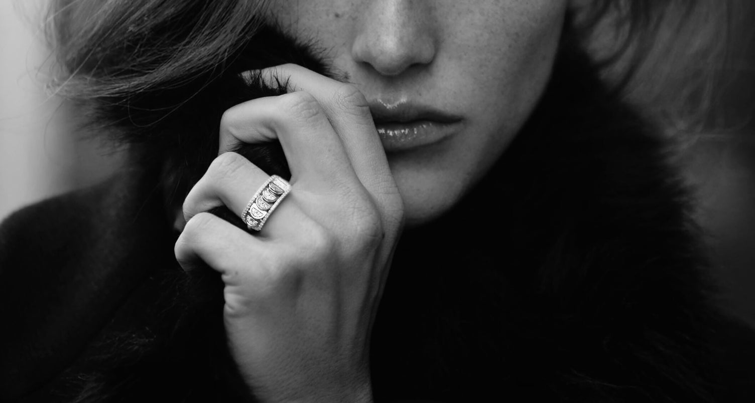 Model wearing Canadian-made 18k white gold reversible diamond ring from Ecksand's Aura Chrome collection in black and white