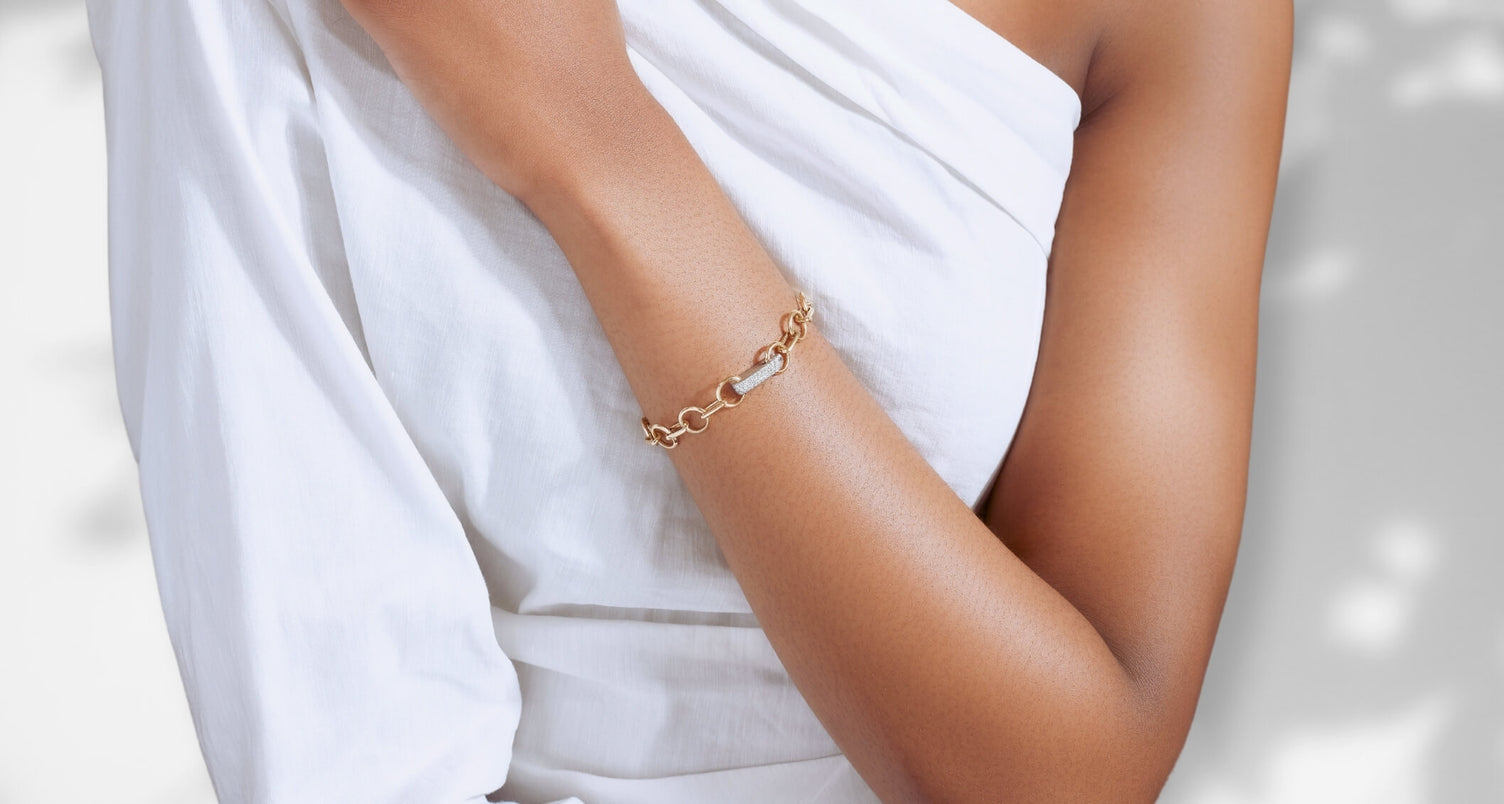 ecksand gold chain bracelet on model on gray background