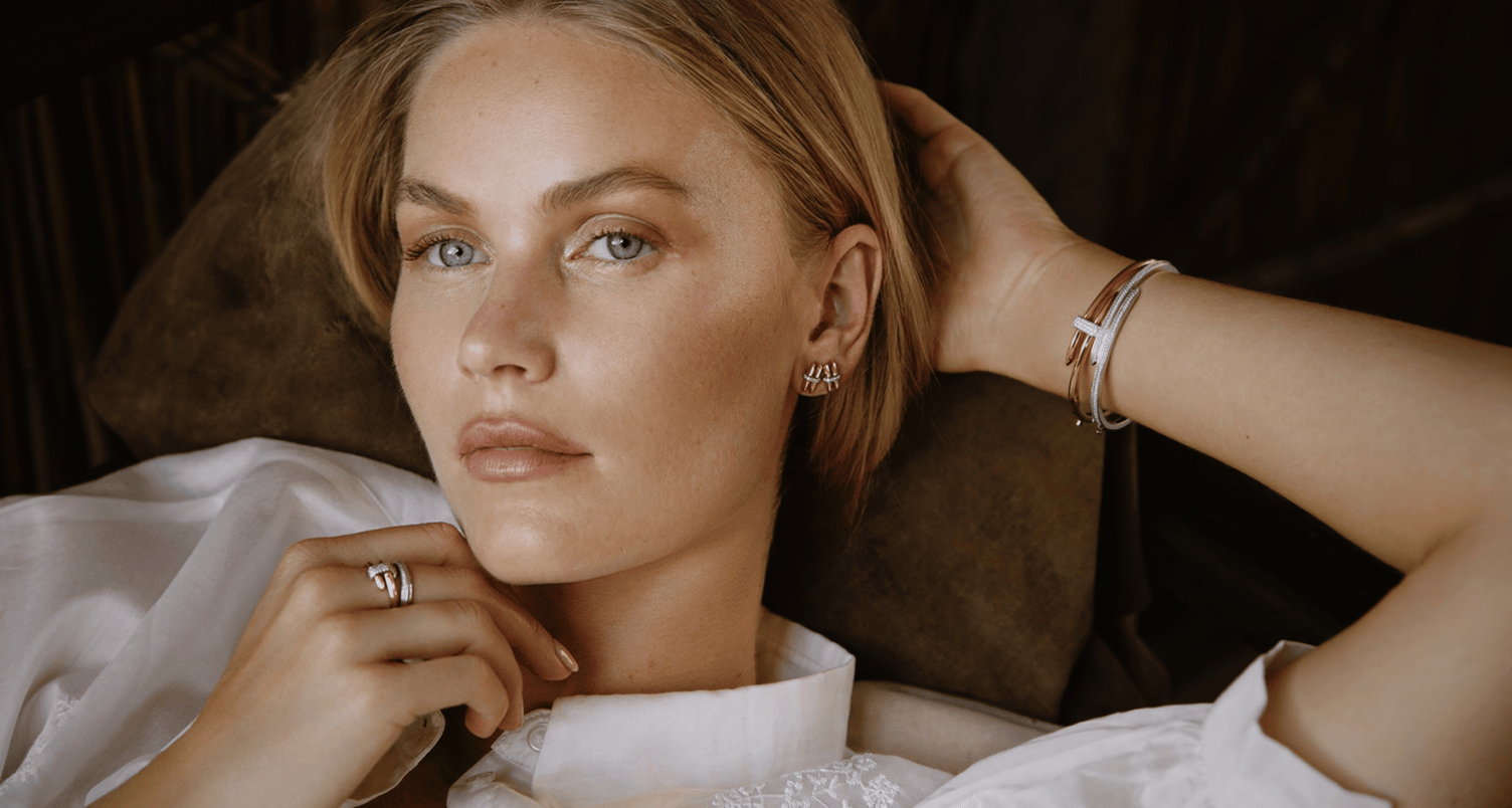 model wearing canadian-made 18k yellow and white gold diamond jewelry from ecksand's duel collection