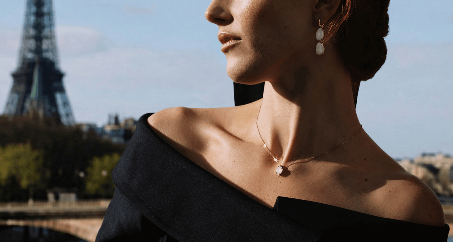 model wearing canadian-made ecksand moonstone gemstone dangling earrings and pendant chain necklace in 14k rose gold in paris