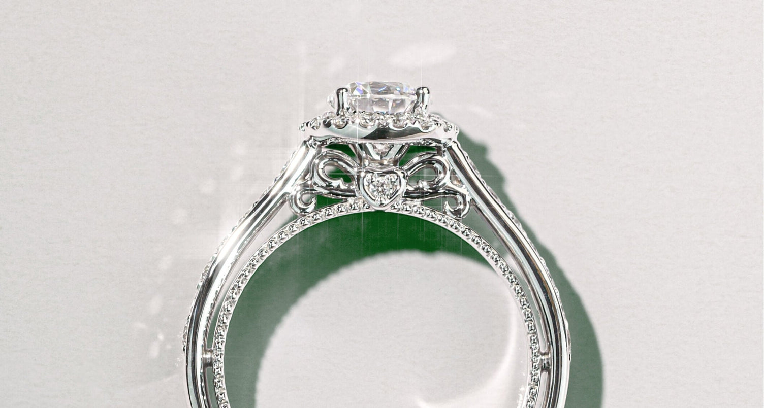 a canadian-made 18k white gold halo engagement ring with vintage band and hidden diamond