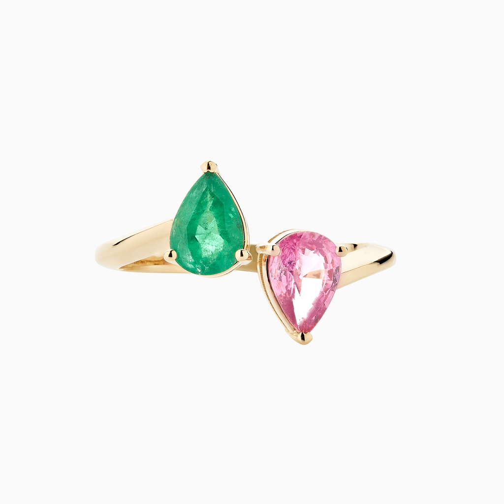 The Ecksand Two-Stone Pear-Cut Pink Sapphire and Emerald Ring shown with  in 14k Yellow Gold