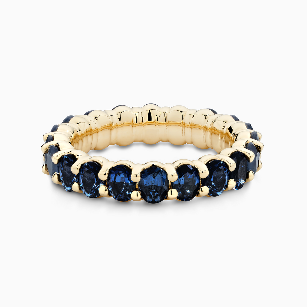 The Ecksand Blue Sapphire Eternity Ring shown with  in 18k Yellow Gold