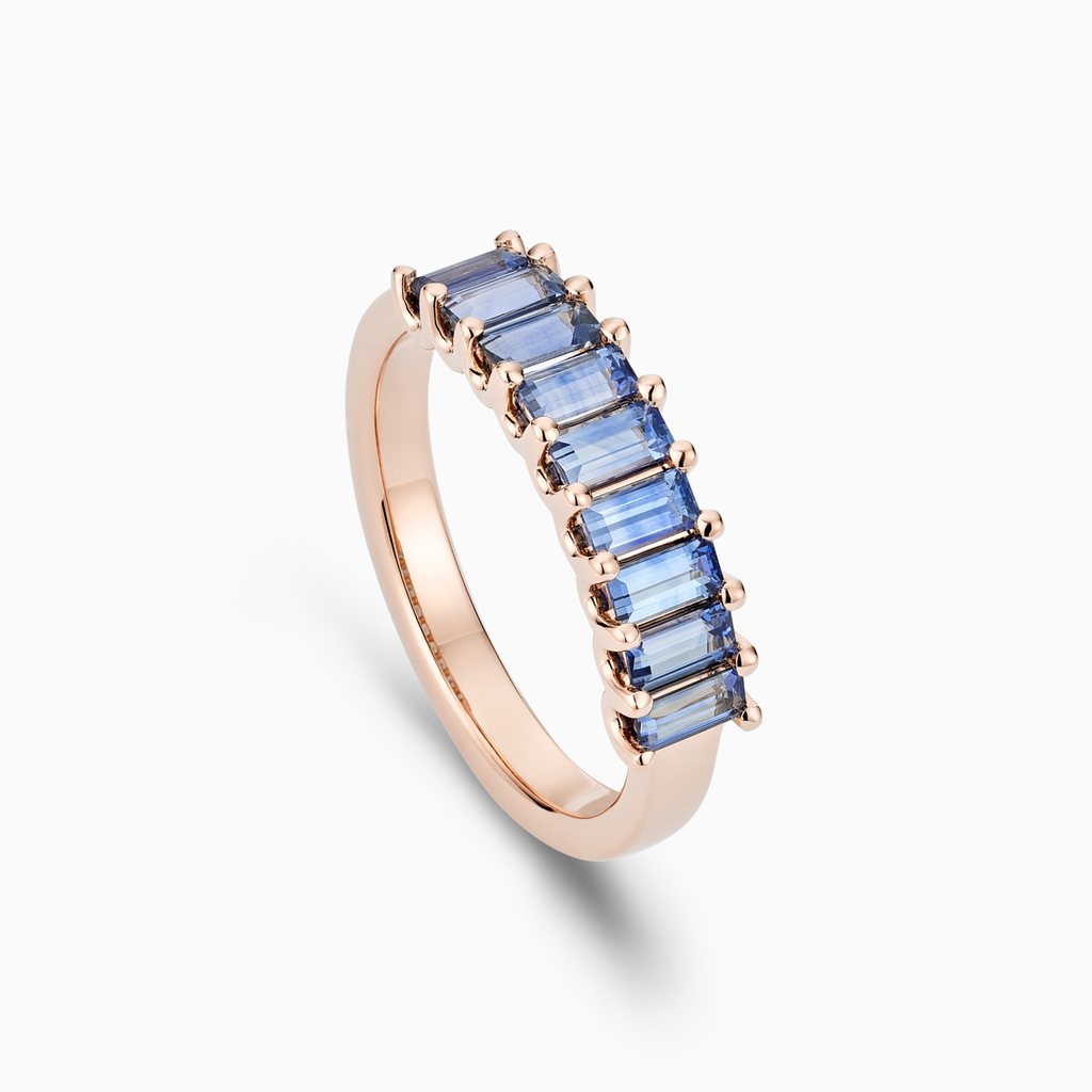 Angled view of Ecksand's Baguette-Cut Blue Sapphire Ring in 14k Rose Gold