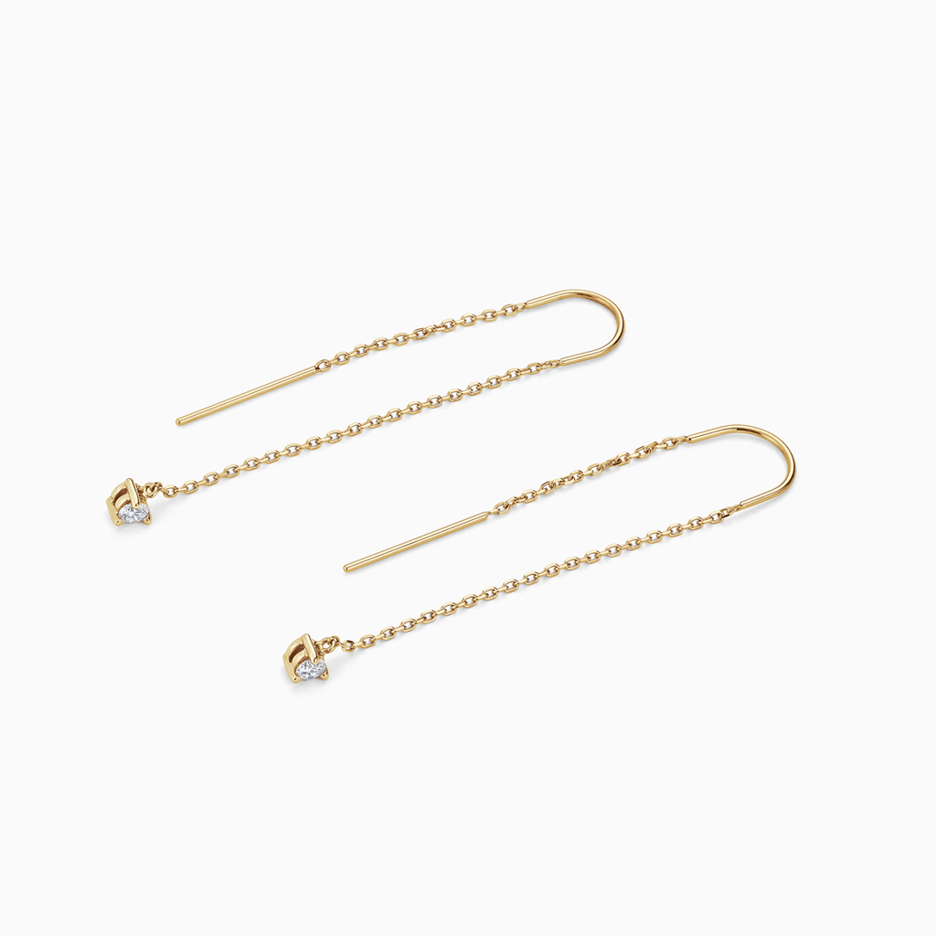 The Ecksand Three-Prong Diamond Dangle Earrings shown with  in 
