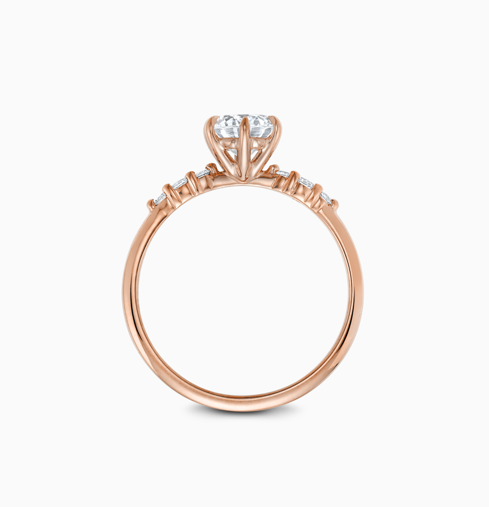 Profile view of Ecksand's Engagement Ring with Eagle Prongs and Side Diamonds in 14k Rose Gold, Radiant