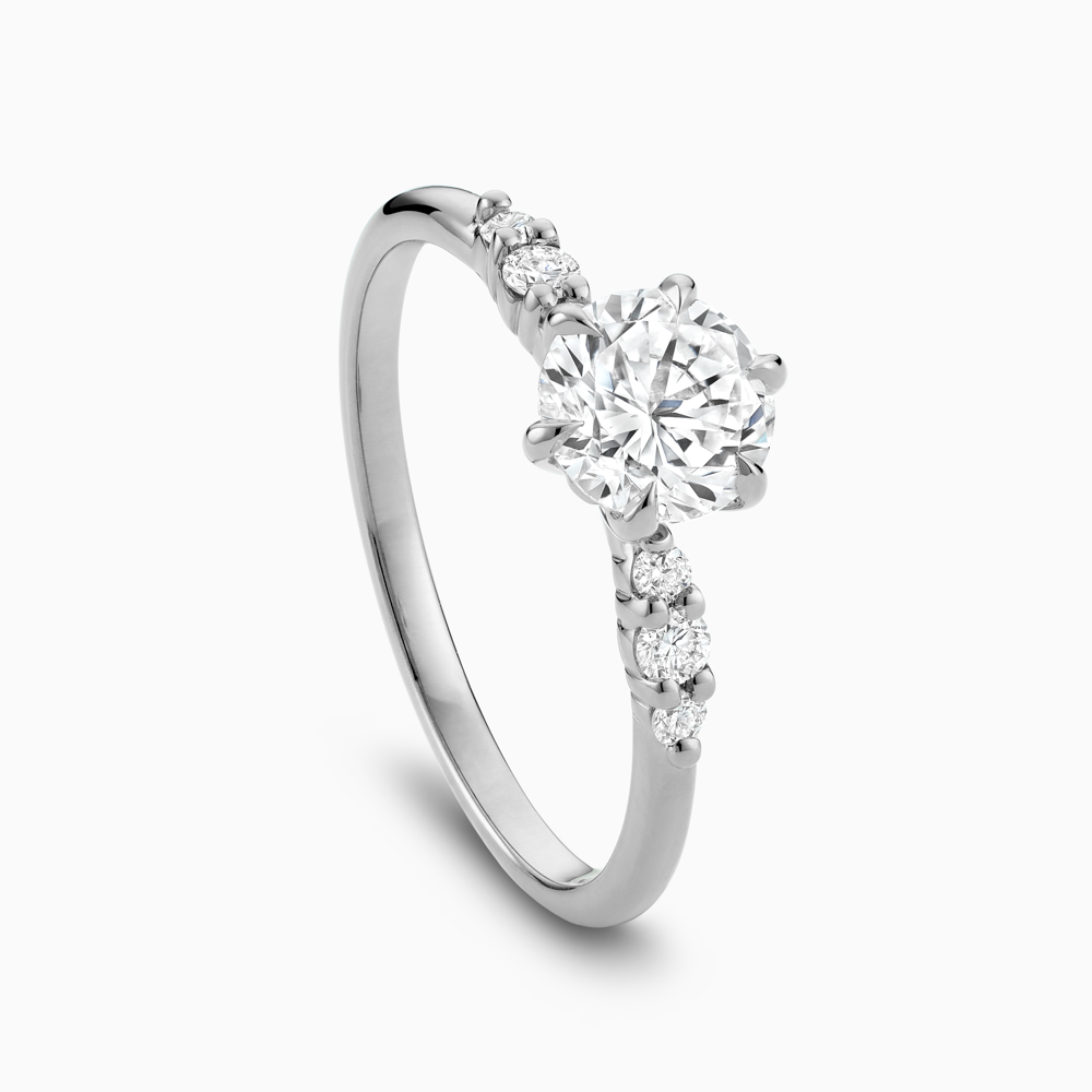 The Ecksand Engagement Ring with Eagle Prongs and Side Diamonds shown with  in 