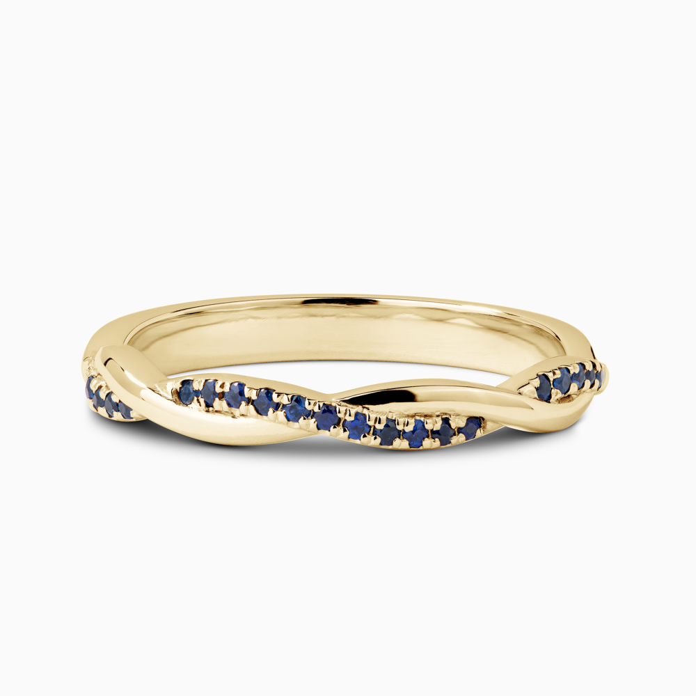 The Ecksand Twisted Wedding Ring with Accent Blue Sapphires shown with  in 18k Yellow Gold