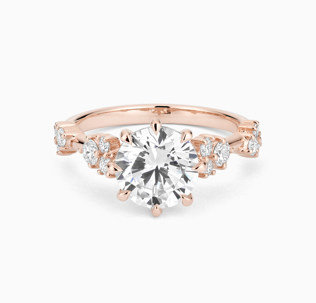 The Ecksand Eight-Prong Blossom Engagement Ring with Side Diamonds shown with Round in 14k Rose Gold