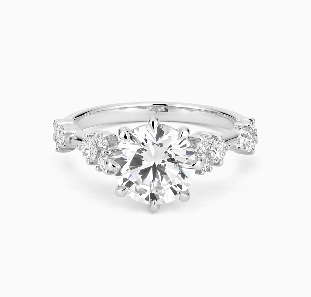 Angled view of Ecksand's Eight-Prong Blossom Engagement Ring with Side Diamonds in Platinum, Round