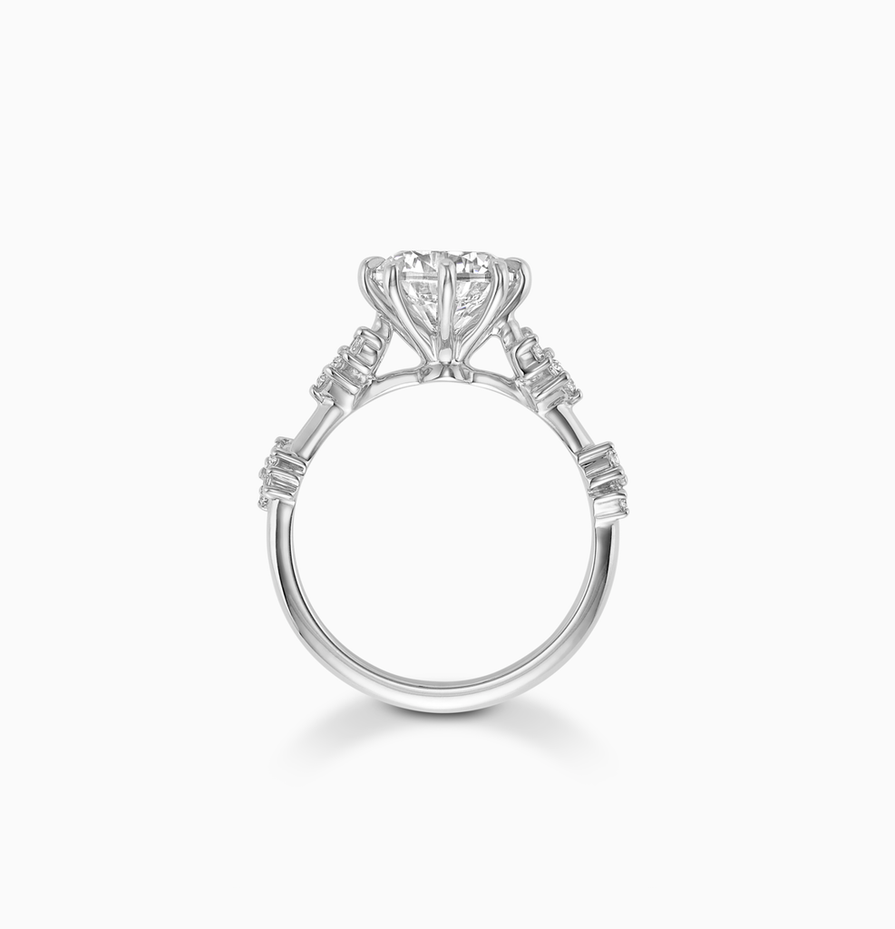 Angled view of Ecksand's Eight-Prong Blossom Engagement Ring with Side Diamonds in Platinum, Round #2