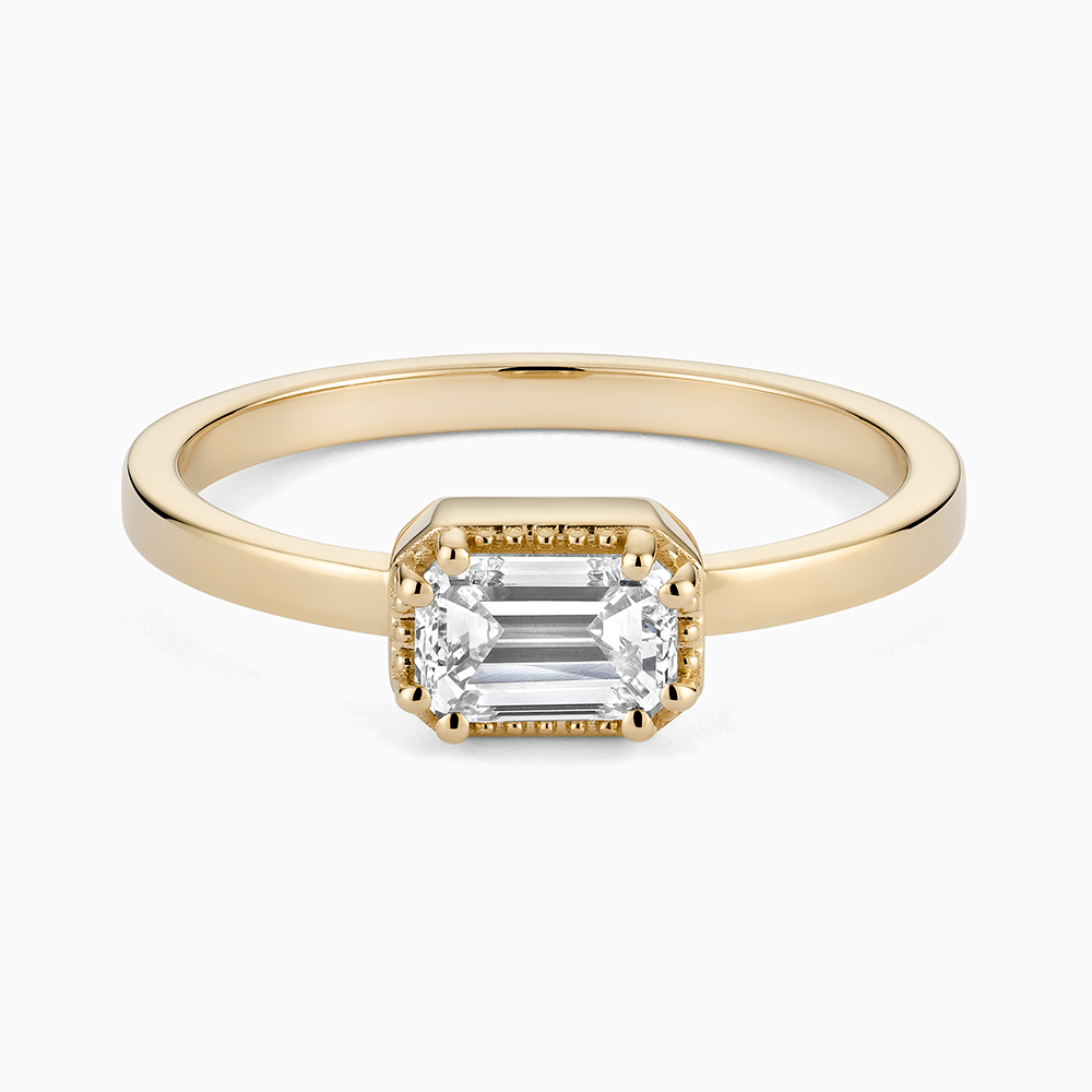 Face view of Ecksand's Emerald Diamond Stackable Ring with Milgrain Halo in 18k Yellow Gold, Natural VS2+/F+