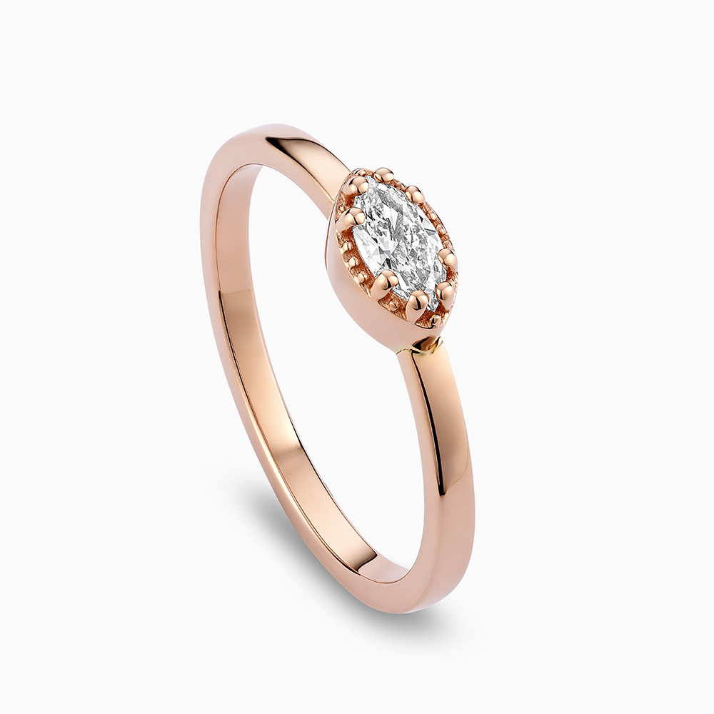 Angled view of Ecksand's Marquise Diamond Stackable Ring with Milgrain Halo in 18k Rose Gold, Lab-grown VS2+/F+