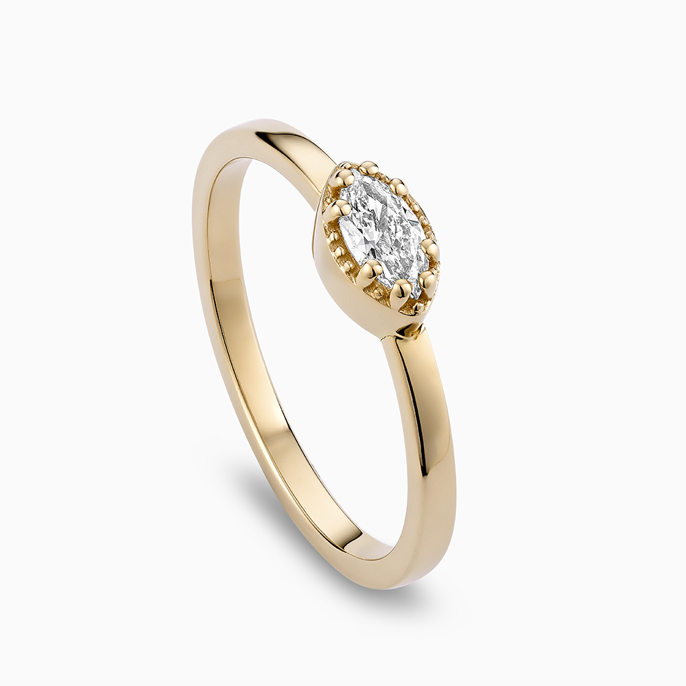 Angled view of Ecksand's Marquise Diamond Stackable Ring with Milgrain Halo in 18k Yellow Gold, Lab-grown VS2+/F+