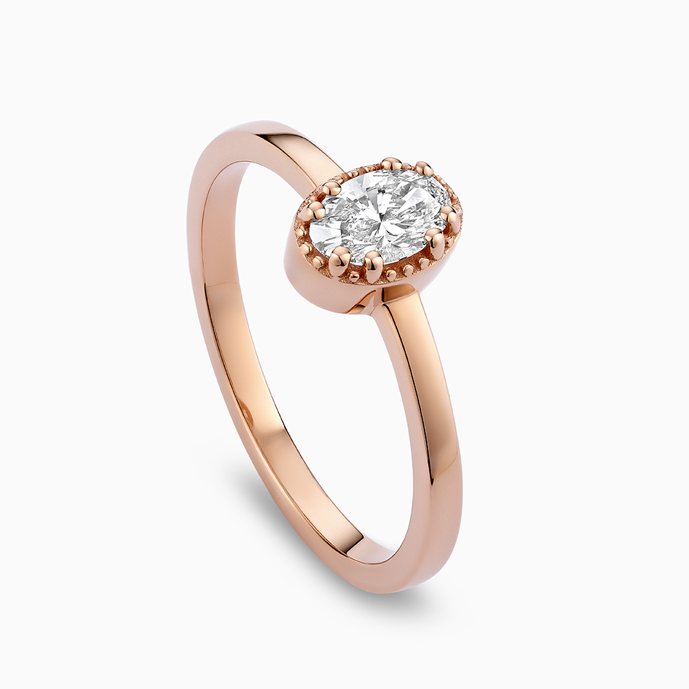 Angled view of Ecksand's Oval Diamond Stackable Ring with Milgrain Halo in 18k Rose Gold, Lab-grown VS2+/F+