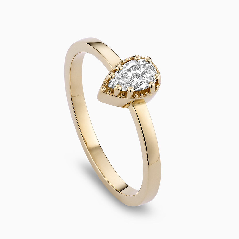 Angled view of Ecksand's Pear Diamond Stackable Ring with Milgrain Halo in 18k Yellow Gold, Lab-grown VS2+/F+