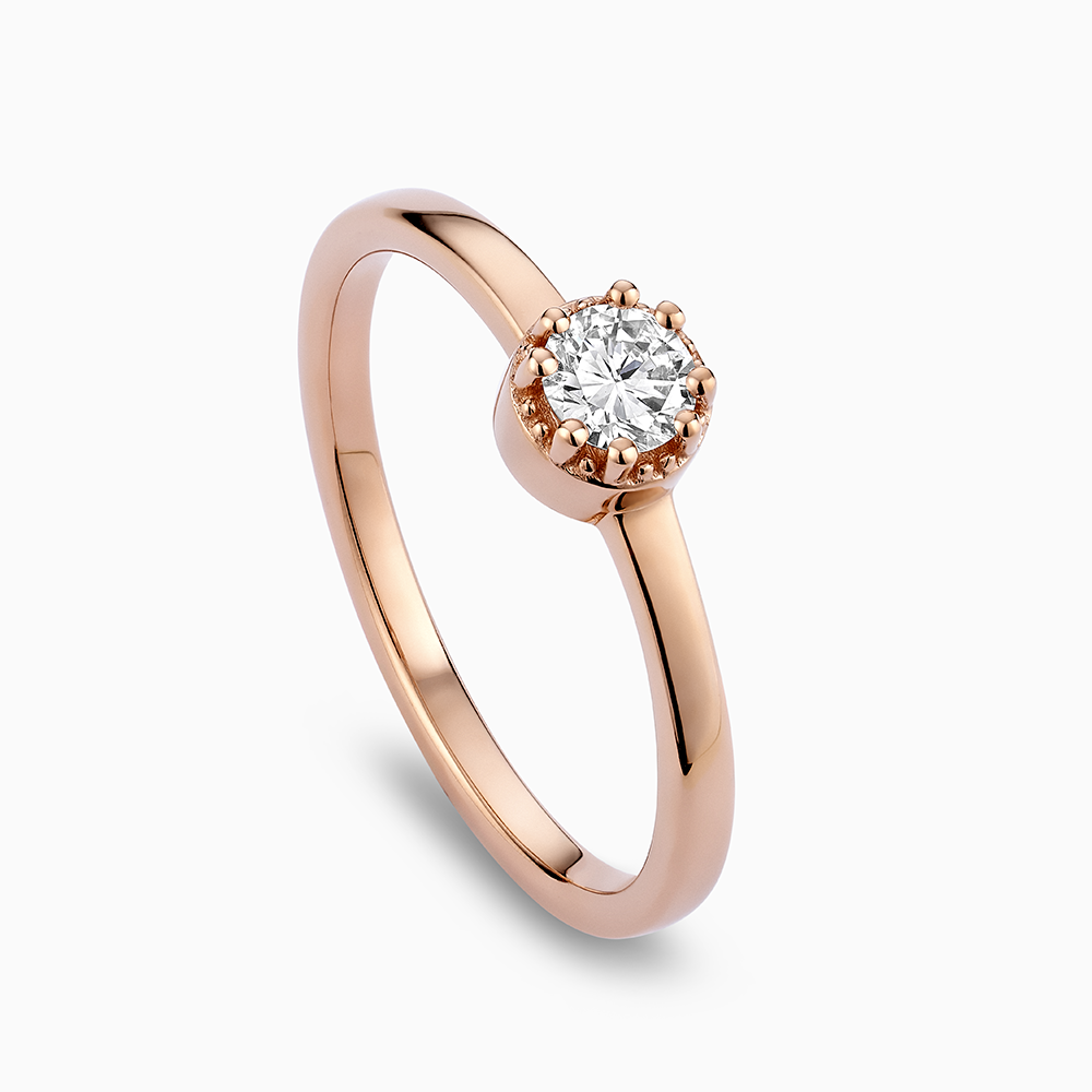 Angled view of Ecksand's Round Diamond Stackable Ring with Milgrain Halo in 18k Rose Gold, Lab-grown VS2+/F+