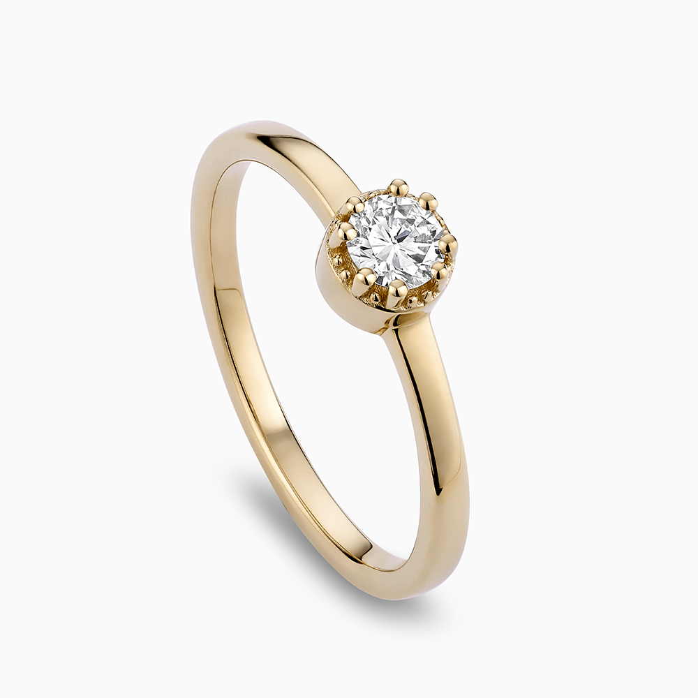 Angled view of Ecksand's Round Diamond Stackable Ring with Milgrain Halo in 18k Yellow Gold, Lab-grown VS2+/F+