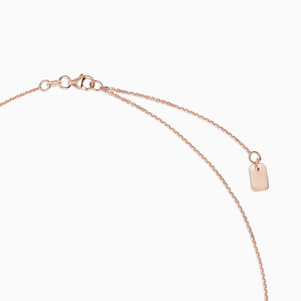 Angled view of Ecksand's Emerald Stackable Necklace with Milgrain Halo in 14k Rose Gold #2