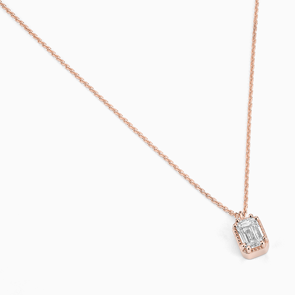 Angled view of Ecksand's Emerald Diamond Stackable Necklace with Milgrain Halo in 18k Rose Gold, Lab-grown VS2+/F+